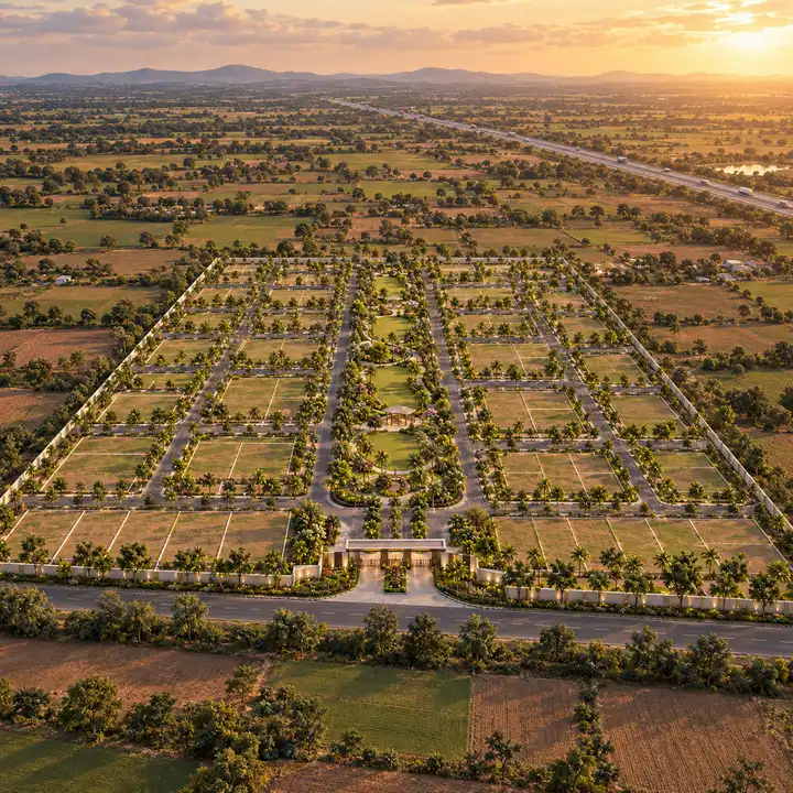 Sattva Dabaspete aerial view of a plotted layout with tree-lined roads, a central green spine and a highway beyond, artist's impression